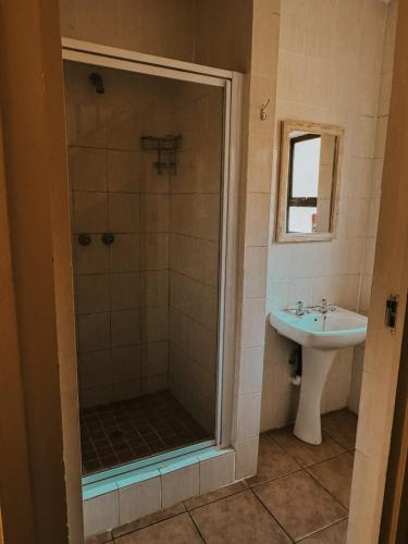 a bathroom with a shower and a sink at Sea View in Coffee Bay