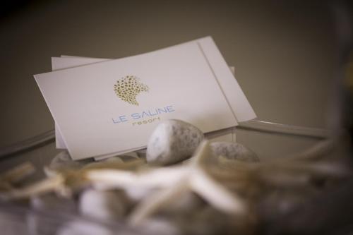 a box and some rocks on a table at Le Saline Beach Resort in Saline Joniche