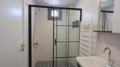 a shower with a glass door in a bathroom at One way in Kayseri