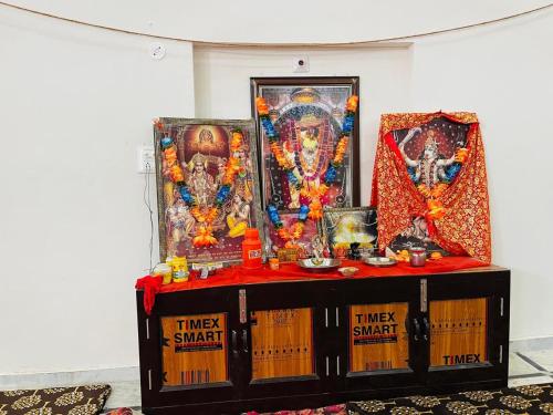 a table with religious items on top of it at Sankant Mochan Ashram in Toda Bhīm