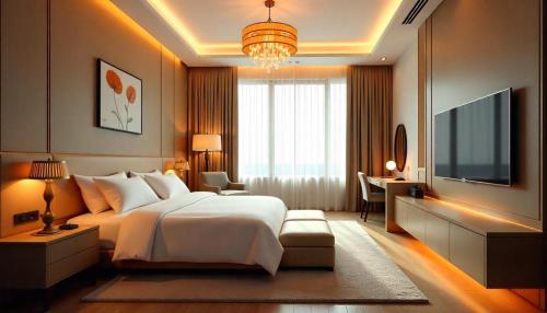 a bedroom with a large bed and a television at The Precesion Palace Hotel Near IGI Airport in New Delhi