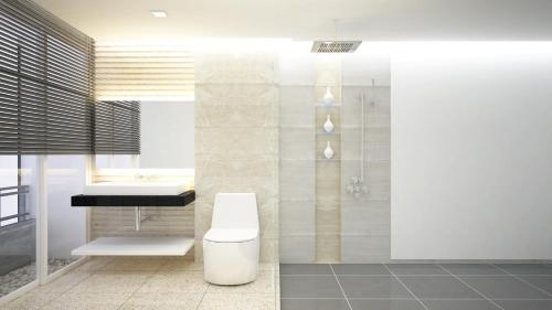 a bathroom with a toilet and a sink and a shower at The Precesion Palace Hotel Near IGI Airport in New Delhi
