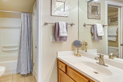 a bathroom with a sink and a toilet and a mirror at Quiet and Convenient! Condo with Balcony Near ASU in Tempe Royal Palms
