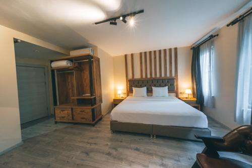 Postel nebo postele na pokoji v ubytování Grand 464 Otel