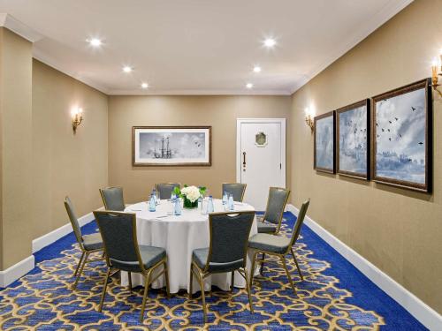 a meeting room with a table and chairs at Fairmont Chateau Laurier in Ottawa