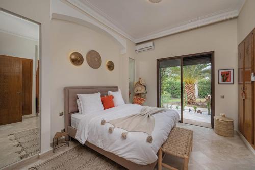 Ένα ή περισσότερα κρεβάτια σε δωμάτιο στο Villa AIMA - avec Gourvernante