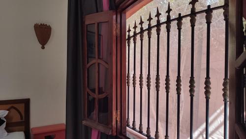 a iron gate in a room with a window at FEKHARA Country Club in Marrakech