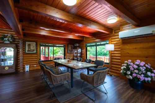 a dining room with a table and chairs at Monlada Khaoyai in Mu Si