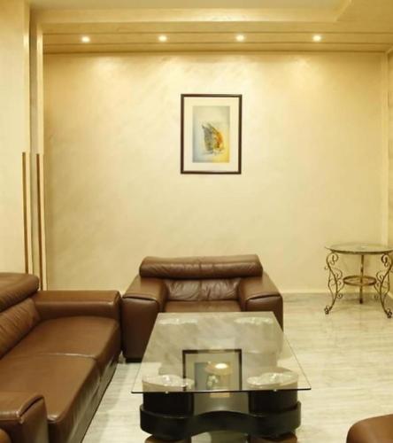 a living room with a couch and a table at Amor Fati in Yerevan