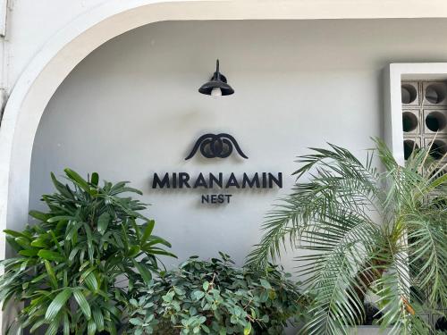 a sign on the side of a building at MiraNamin Nest LANTANA SUITE in Unique Historic Home with Garden Access, Rooftop, Bathtub, Private Kitchen in Manila