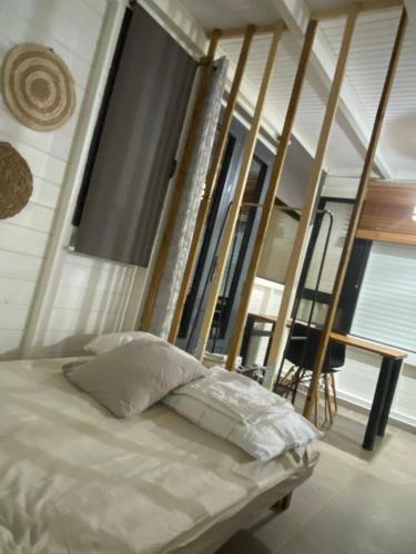 Ένα ή περισσότερα κρεβάτια σε δωμάτιο στο Maison zen