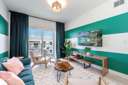 a living room with a blue and green wall at Event-Ready 2BR 2BA Near Stadium & Beach includes Parking and Washer and Dryer in Hallandale Beach