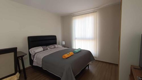 Postel nebo postele na pokoji v ubytování Elegante monoambiente