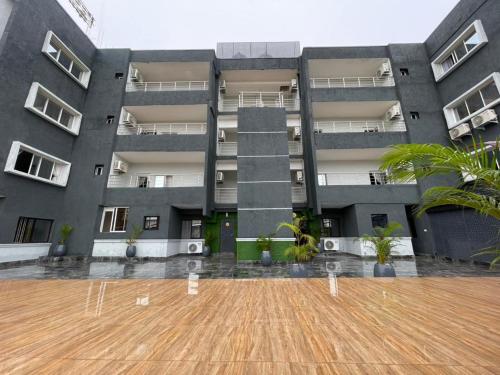 an empty courtyard in front of a building at Presken Residence in Ikeja