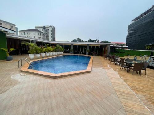 a swimming pool on top of a building at Presken Residence in Ikeja