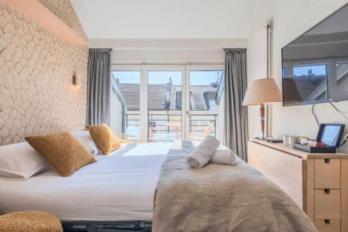 Ένα ή περισσότερα κρεβάτια σε δωμάτιο στο Residence CITYZEN - Genève