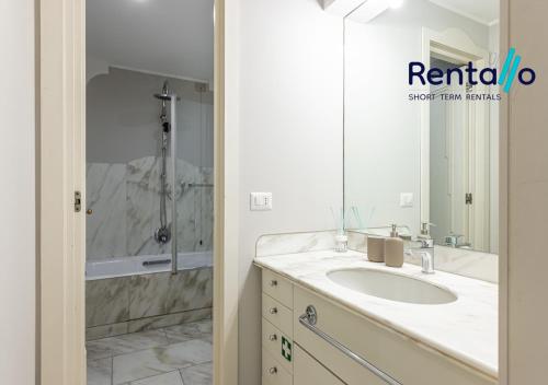 a bathroom with a sink and a shower at Duomo Delight Suite - 200 meters from the Duomo in Milan