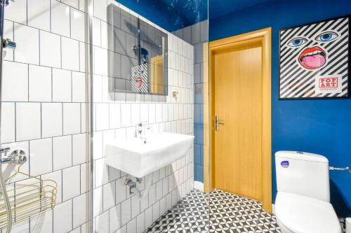a bathroom with a sink and a toilet at Super Fresh! 3bdr Apartment In Sofia Center's Artistic Area in Sofia