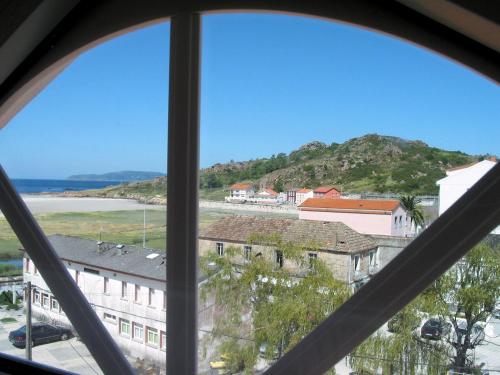a view from a window of a building at Apartamentos Playa Monte Pindo - Lobeira do Mar in O Pindo