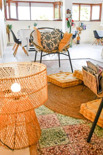 a living room with a couch and chairs and a table at Hotel Oasis in Grande Anse