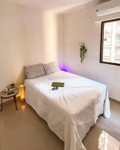 Postel nebo postele na pokoji v ubytování Apartamento em Pitangueiras - Four Seasons Guarujá