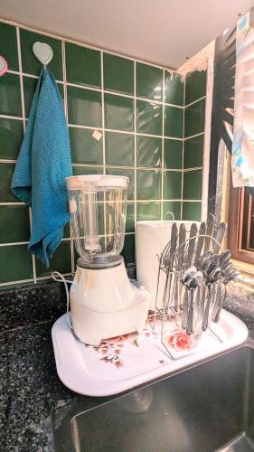 a blender sitting on top of a kitchen counter at GraceApartment in Kampala