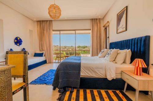 Una cama o camas en una habitación de Riad Tammam