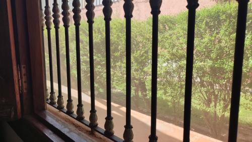 a window with a view of a tree at FEKHARA Country Club in Marrakech