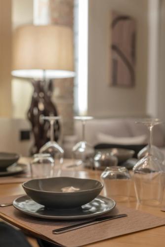 a table with a black bowl and glasses on it at Borgo Rotondo in San Giovanni in Persiceto
