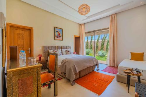 Una cama o camas en una habitación de Riad Tammam