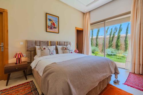 Una cama o camas en una habitación de Riad Tammam