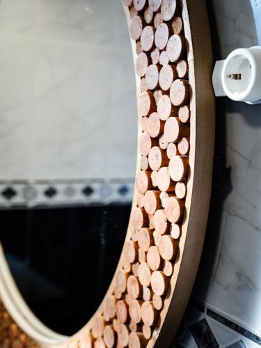a mirror with a bunch of wine corks at Brisa do Nordeste in Nordestinho