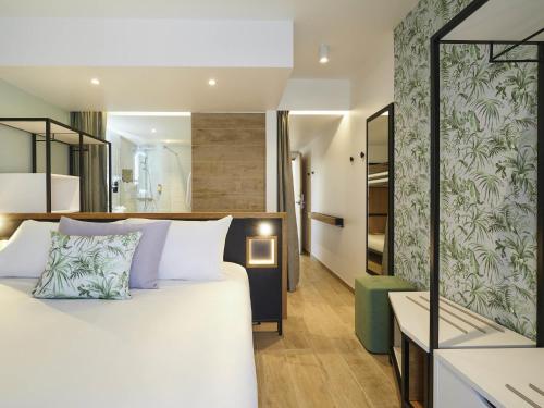 Ένα ή περισσότερα κρεβάτια σε δωμάτιο στο Mercure Avignon Gare TGV
