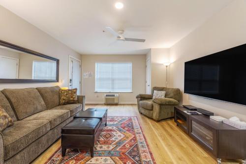 a living room with a couch and a flat screen tv at 15 Lodge in Hood River