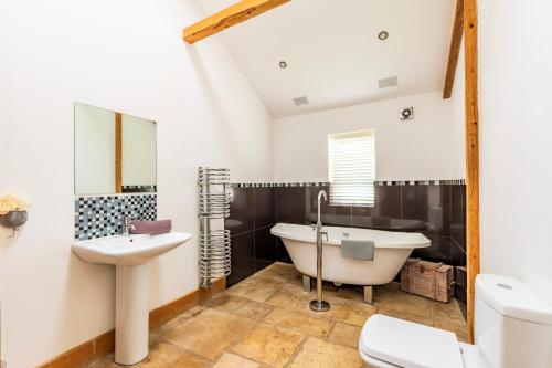 Et badeværelse på Hobland Barns by Leap Escapes