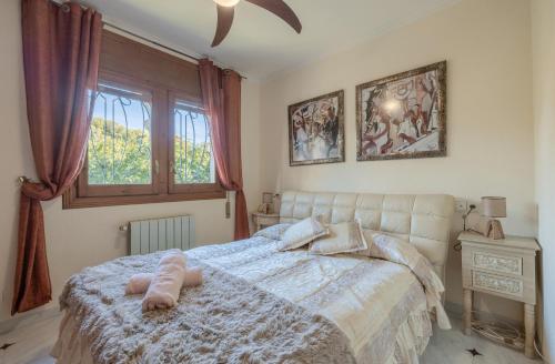 En eller flere senge i et værelse på Villa Paraiso para 6