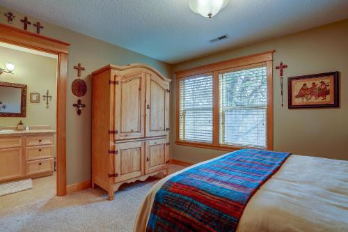 a bedroom with a bed and a sink and a window at Wanderlust in Hood River