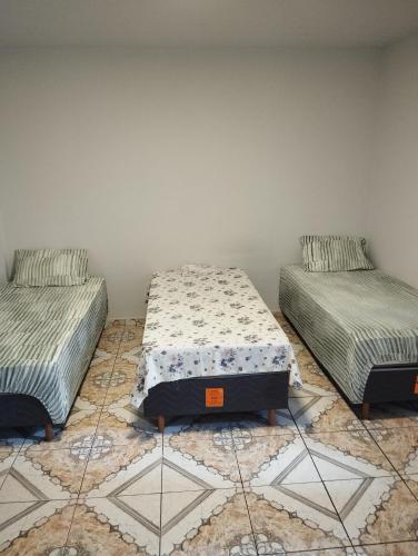 Postel nebo postele na pokoji v ubytování Residencial Humberto Mendes