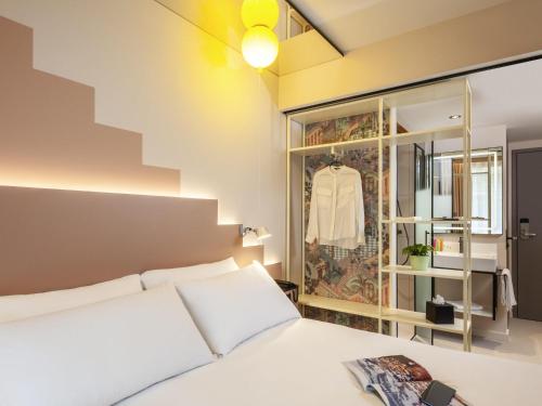 Letto o letti in una camera di ibis Styles Zurich City Center