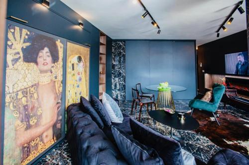 a living room with a couch and a table at Deluxe Maisonnette Skopje Center Ultra Modern Elegant Superb Sophisticated in Vodno