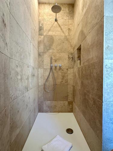 a bathroom with a shower with a toilet in it at Eisenturm - Stadthaus, Turmgewölbe in Freinsheim