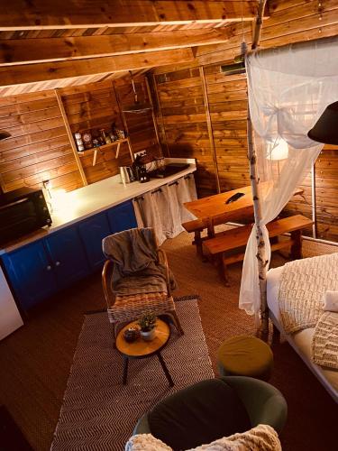 a living room with a couch and a table at Refuge de Campagne Le Chalet in Chaix