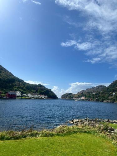a large body of water with mountains in the background at ASFeriehus in Flekkefjord