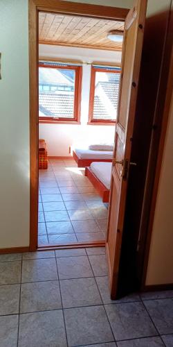 a room with a door and a room with a window at ASFeriehus in Flekkefjord