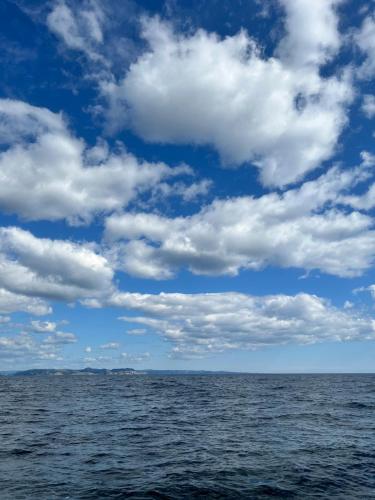 a large body of water with a cloudy sky at ASFeriehus in Flekkefjord