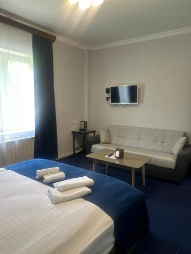 Кровать или кровати в номере Hotel Saya