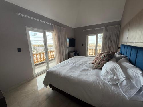 Кровать или кровати в номере GUAJIRA CASA DEL MAR