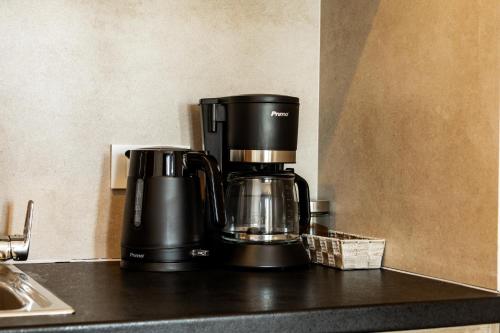 a coffee maker sitting on top of a counter at Helios Sivota in Sivota