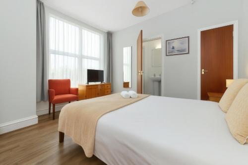 Postel nebo postele na pokoji v ubytování Shelford Lodge