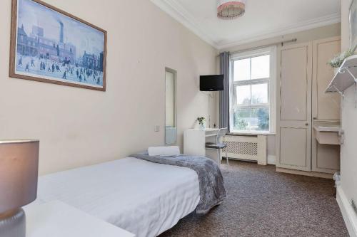 Postel nebo postele na pokoji v ubytování Shelford Lodge